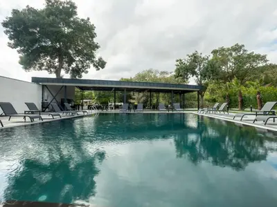 a swimming pool with chairs and a pavilion at Verona Ağva in Sile