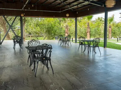 a group of tables and chairs on a patio at Verona Ağva in Sile