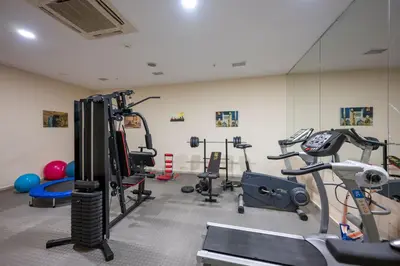 a gym with several exercise equipment in a room at Harmony Hotel Merter & SPA in Istanbul