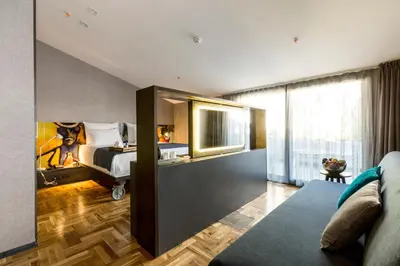 a hotel room with a bed and a large window at Lampa Design Hotel-Special Category in Istanbul