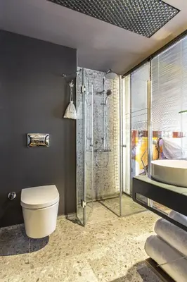 a bathroom with a shower and a toilet and a sink at Lampa Design Hotel-Special Category in Istanbul