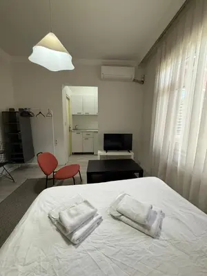 a bedroom with a bed with two towels on it at Şişli Suites - Room21 in Istanbul