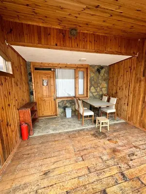 a room with a table and chairs in a cabin at Aytepepark Turistik tesisleri