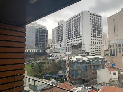 a view of a city with tall buildings at Taksim'de 2 yatak odalı daire, güvenlik, havuz, spa, otopark in Istanbul