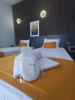 a hotel room with two beds with white towels on them at Rota Business Hotel Gebze in Güzeltepe