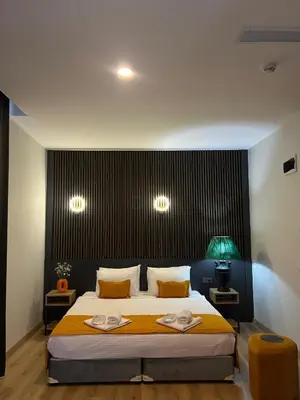 a bedroom with a large bed with two towels on it at Rota Business Hotel Gebze in Güzeltepe