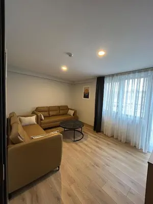 a living room with a couch and a table at Rota Business Hotel Gebze in Güzeltepe