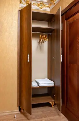 a closet with a wooden door and a drawer at The Ottoman apartment in Istanbul
