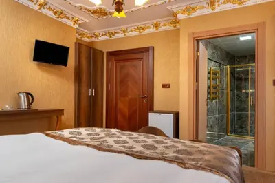 a bedroom with a bed and a sliding glass door at The Ottoman apartment in Istanbul