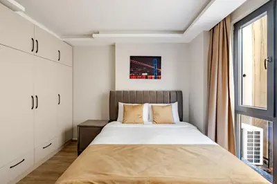 a bedroom with a bed and a window at B Polat in Istanbul