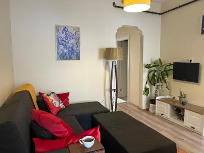 a living room with a couch and a tv at Karakaş Homes in Istanbul