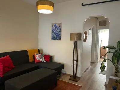 a living room with a couch and a lamp at Karakaş Homes in Istanbul