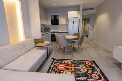 a living room with a couch and a table at Boamonti Residence Sisli Apart in Istanbul