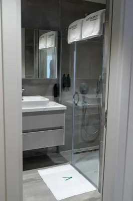 a bathroom with a shower and a sink at Boamonti Residence Sisli Apart in Istanbul