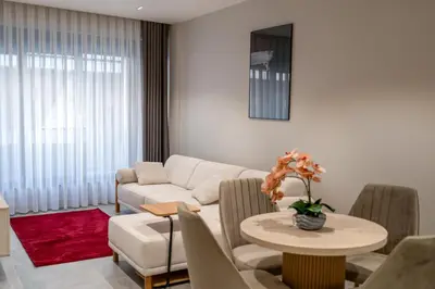 a living room with a couch and a table at Boamonti Residence Sisli Apart in Istanbul