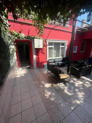 a red building with two benches in front of it at Şişli Suites - Room44 in Istanbul