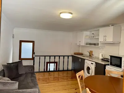 a living room with a couch and a table at Balat Homes & Apartments Nick in Istanbul