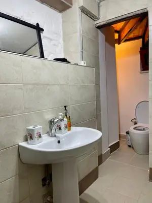 a bathroom with a sink and a toilet at Balat Homes & Apartments Nick in Istanbul
