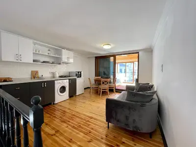 a kitchen and living room with a couch and a table at Balat Homes & Apartments Nick in Istanbul