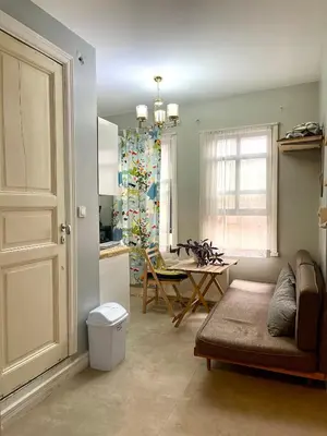 a living room with a couch and a table at Balat Homes & Apartments Cottage in Istanbul