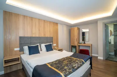 a bedroom with a large bed in a room at Hotel Martini in Istanbul