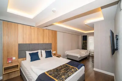 a hotel room with a bed and a television at Hotel Martini in Istanbul
