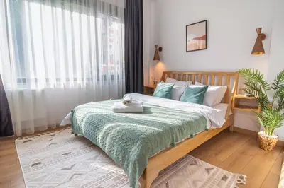 a bedroom with a bed with a green blanket at Firuzağa Retreat Studio in Beyoğlu in Istanbul
