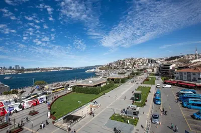 a city with a parking lot next to the water at Boğaz Yalı Dairesi in Istanbul