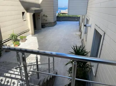 a view of a balcony of a building with plants at Boğaz Yalı Dairesi in Istanbul