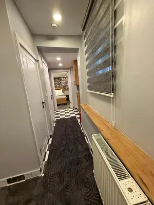 a hallway with stairs leading to a room at AYD Apartment Beyoğlu in Istanbul