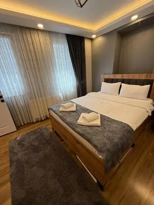 a bedroom with a bed with two towels on it at AYD Apartment Beyoğlu in Istanbul
