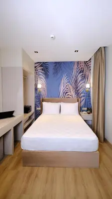 a bedroom with a large white bed in a room at Park Dedeman Sisli - Istanbul City Center in Istanbul