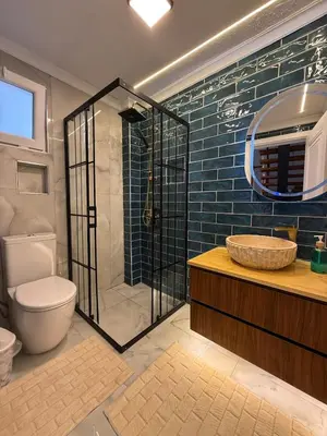 a bathroom with a shower and a toilet and a sink at Doğayla İç içe Lüks Villa in İznik