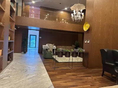 a lobby with a table and chairs and a chandelier at 91 sqm luxury apartment with double view in Istanbul