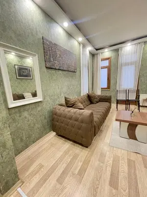 a living room with a couch and a table at Taksim Historic House hotel in Istanbul