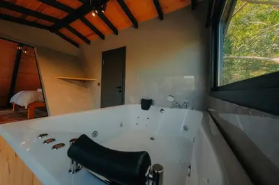 a large white tub in a bathroom with a window at Nevbahar Sapanca ile Lüks Bir Tatile Merhaba Deyin in Sapanca