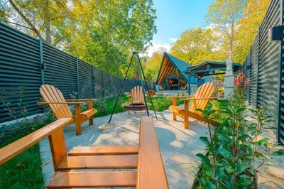a patio with two benches and a swing at Nevbahar Sapanca ile Lüks Bir Tatile Merhaba Deyin in Sapanca