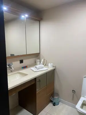 a bathroom with a sink and a mirror and a toilet at paradise hotel in Istanbul