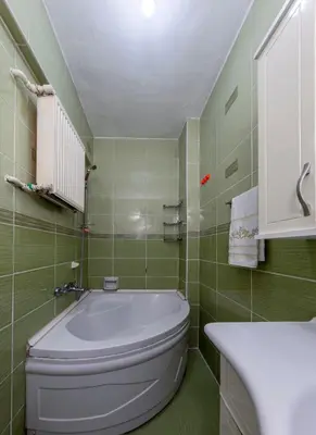a bathroom with a white toilet and a sink at Şehir Manzaralı Ferah Daire in Istanbul