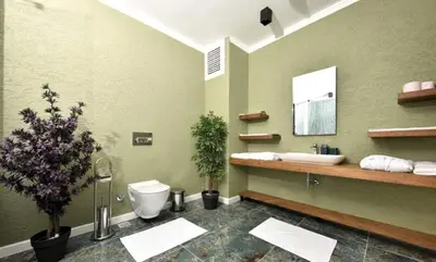 a bathroom with a sink and a toilet and a mirror at Treekos Boutique Hotel Istanbul Airport in Karaburun