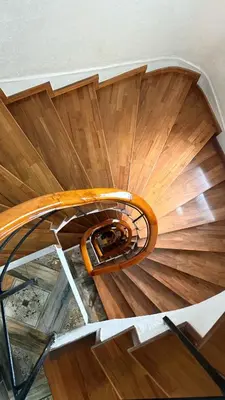 a wooden spiral staircase in a building at Kurban Otel in Istanbul