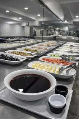 a buffet line with many different types of food at Kurban Otel in Istanbul