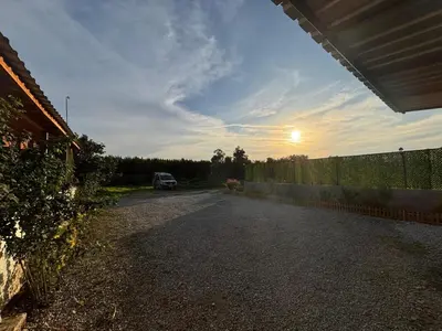 an empty road with a car parked on the side at Quiet House in İznik