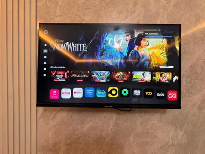 a flat screen tv hanging on a wall at The Old Bazaar Suites Apartment in Istanbul
