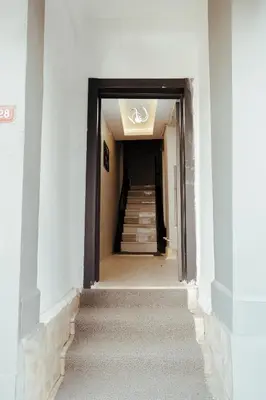 an empty hallway with stairs in a building at The Old Bazaar Suites Apartment in Istanbul