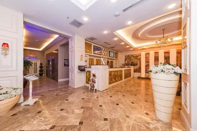 a large room with a large vase of flowers at Marnas Hotels in Istanbul