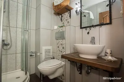 a bathroom with a sink and a toilet and a shower at Hotel SPHENDON in Istanbul