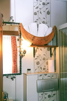 a bathroom with a basket of towels on a shelf at Hotel SPHENDON in Istanbul