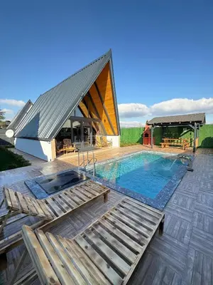 a house with a swimming pool and a building at Zeyno Sapanca in Sapanca