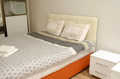 a bedroom with a bed with two pillows on it at My Glamorous Stay at Kadikoy Istanbul Türkiye in Istanbul